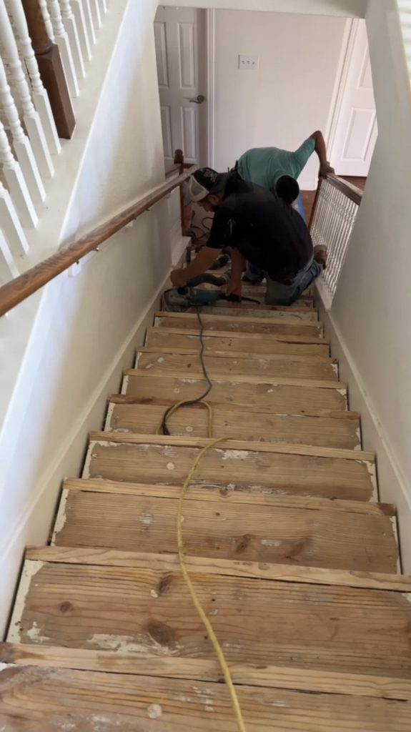 Staircase hardwood floor installation preparation in Austin