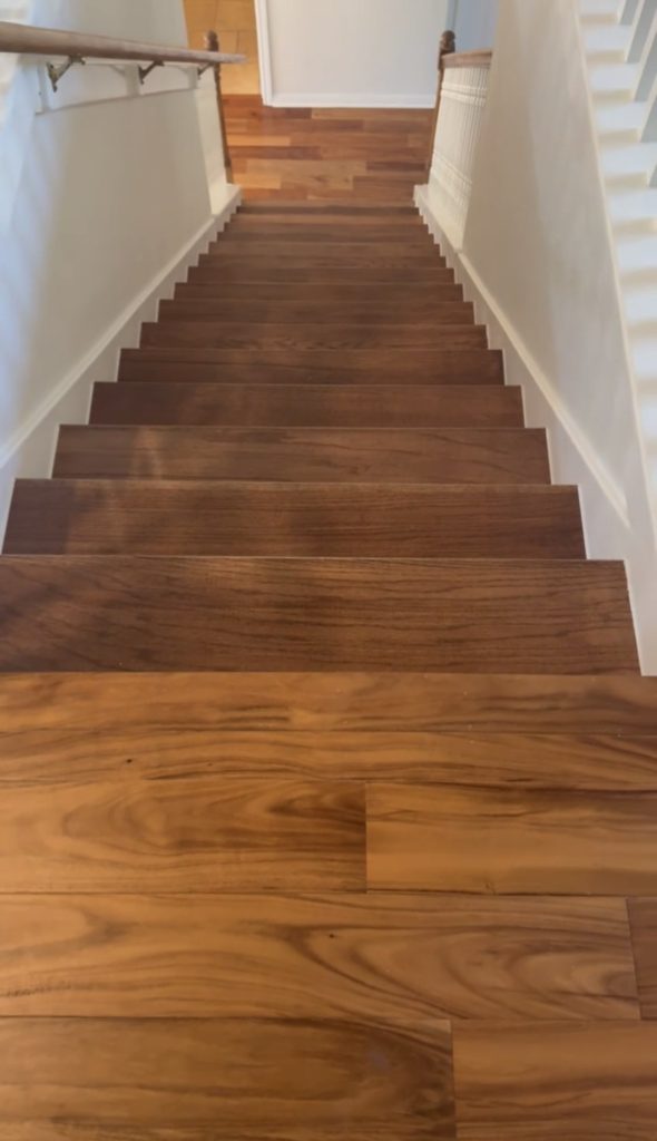 Finished hardwood staircase installation in hallway in Austin, TX by ABC Austin Home Renovations
