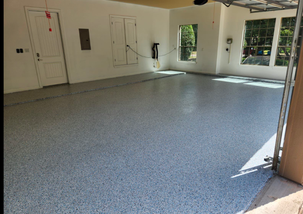 Decorative flake epoxy garage floor coating installed in Austin TX residential garage