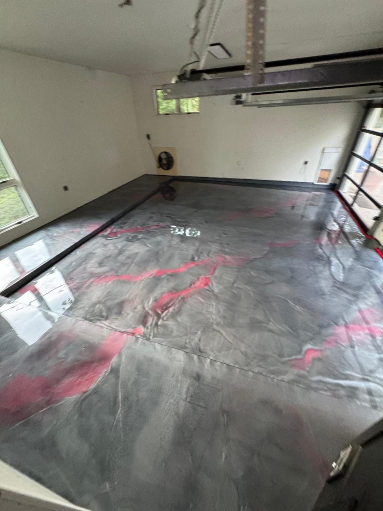 Metallic epoxy garage floor installation in Austin TX with glossy decorative finish